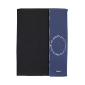 May include: A black and blue leather notebook with a decorative silver circle design and the word "Name" printed on the front.