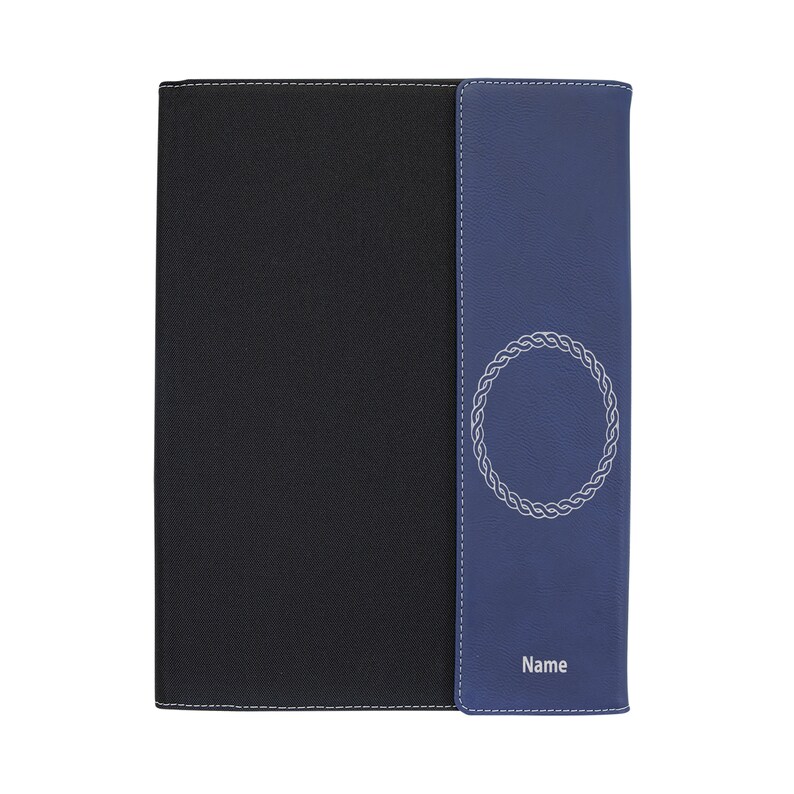 May include: A black and blue leather notebook with a decorative silver circle design and the word "Name" printed on the front.