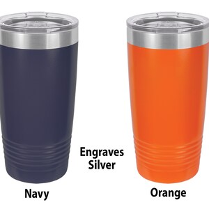 May include: Two stainless steel tumblers with lids. The tumbler on the left is navy blue and the tumbler on the right is orange. Both tumblers have a silver band around the top and engrave silver.