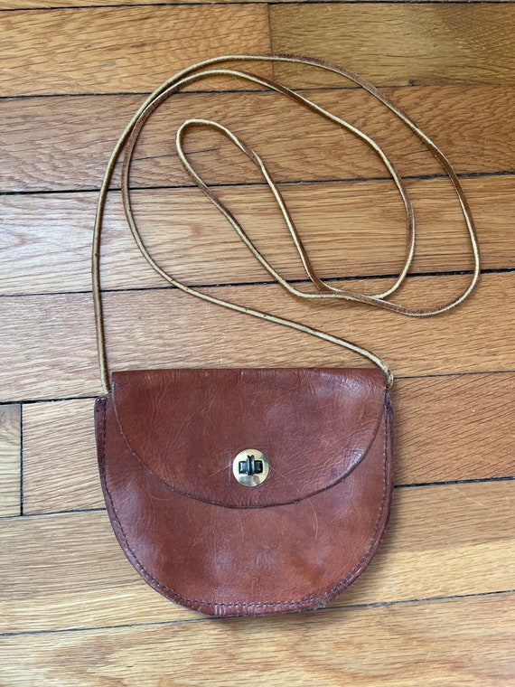 Leather coin purse with gold clasp and cross body 