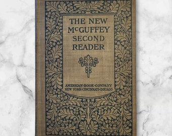 1901. El segundo lector ecléctico del nuevo McGuffey. Excelente estado antiguo. Se siente sin usar. Verdaderamente un hallazgo raro.