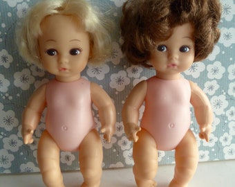 AMANDA JANE BABY Dolls, both sharing the same manufacturer's flaw - bodies which are paler than the rest of the doll, but otherwise perfect!