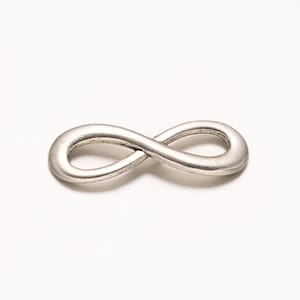 May include: Silver infinity charm, a symbol of endless love and eternity. This charm is perfect for adding a touch of elegance to jewelry projects.