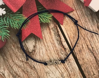 Braccialetto natalizio con tre stelle argentate e cordino dei desideri, scelta di colori e regolabile