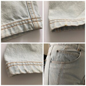 May include: Close-up shots of light blue denim jeans. The images highlight details like the hem, seams, and pocket. The stitching is a contrasting tan color. The denim has a faded, worn appearance.