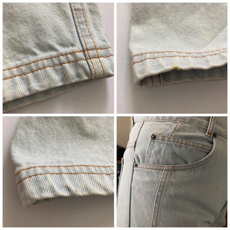 May include: Close-up shots of light blue denim jeans. The images highlight details like the hem, seams, and pocket. The stitching is a contrasting tan color. The denim has a faded, worn appearance.