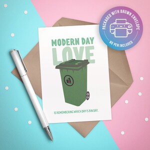 May include: A greeting card featuring a green recycling bin and the text "MODERN DAY LOVE IS REMEMBERING WHICH DAY IS BIN DAY."
