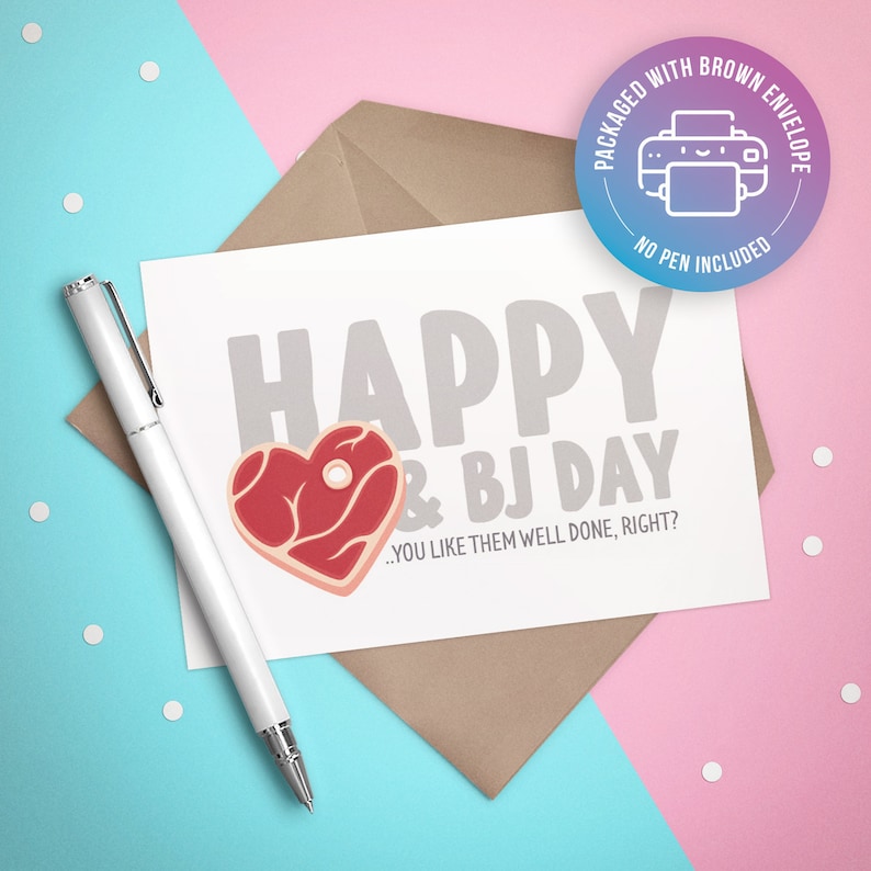 May include: A white card with the text "HAPPY & BJ DAY...YOU LIKE THEM WELL DONE, RIGHT?" and a red heart-shaped steak graphic. The card is on a brown envelope with a blue and pink circle sticker that says "PACKAGED WITH BROWN ENVELOPE NO PEN INCLUDED".