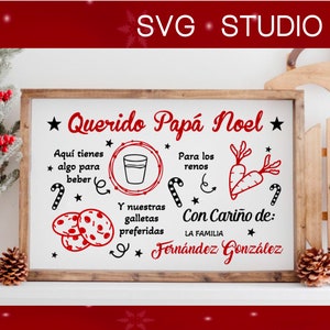 K&ouml;nnte beinhalten: Ein wei&szlig;es Schild mit schwarzem und rotem Text, der "Querido Pap&aacute; Noel" mit einem Stern auf jeder Seite lautet. Das Schild enth&auml;lt auch Illustrationen von einem Glas Milch, Karotten, Keksen und Zuckerstangen. Der Text unter den Illustrationen lautet "Aqu&iacute; tienes * algo para beber * Para los renos * Y nuestras galletas preferidas Con Cari&ntilde;o de: LA FAMILIA Fern&aacute;ndez Gonz&aacute;lez".
