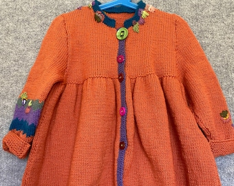 Little girls hand-knitted coat. (72)