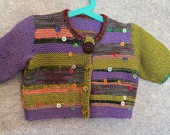 Child's hand-knitted cardigan.