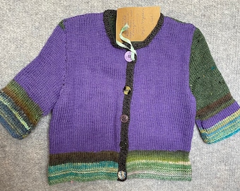 Child's hand-knitted cardigan.