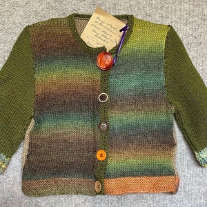 Child's hand-knitted cardigan.