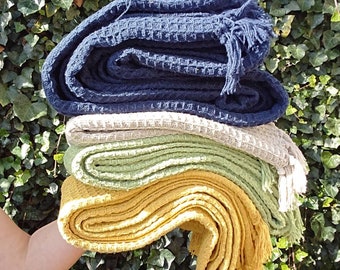 Recycled cotton waffle blanket with personalised embroidery.