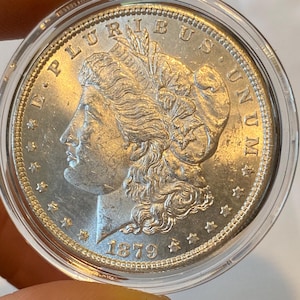 1879 Vintage Morgan Silver Dollar, Bright, White, Uncirculated MS quality.