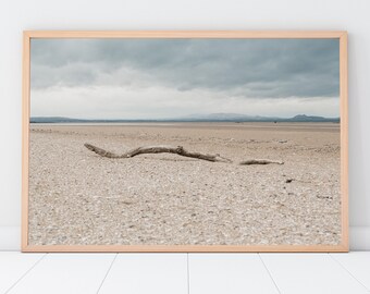 Photographic colour print of a Log laying on a beautiful Scottish beach on a cold day