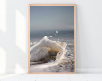 Photographic colour print of Don Quijote de la Mancha book in the Spanish sea being swallowed by waves