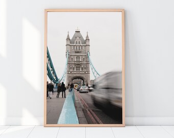 Photographic print of a vehicle passing over the iconic Tower Bridge in London