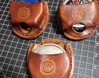 Snuff Can holder, leather.  Snap over the belt Various designs
