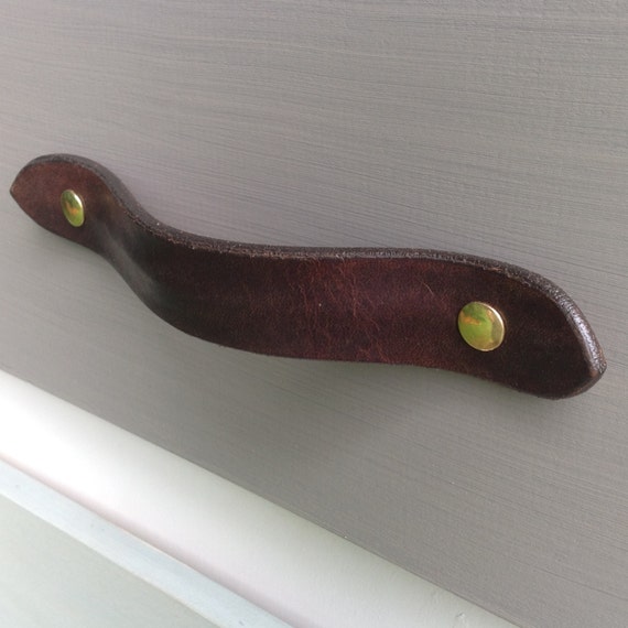 Leather drawer pull for furniture, cabinets, cases, boxes, etc.  Hand crafted from salvaged leather remnants.