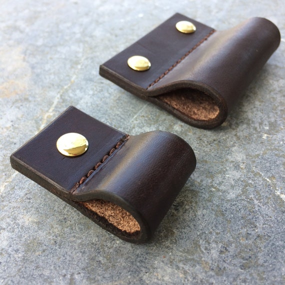 Leather drawer pull for furniture, cabinets, cases, boxes, etc.  Hand crafted from salvaged leather remnants.