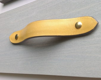 Leather drawer pull for furniture, cabinets, cases, boxes, etc.  Hand crafted from salvaged leather remnants.