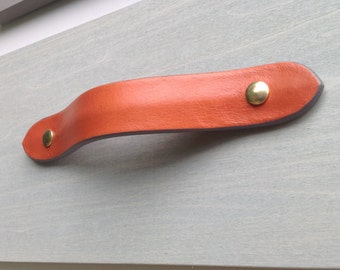 Orange leather drawer pull for furniture, cabinets, cases, boxes, etc.  Hand crafted from salvaged leather remnants.