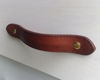 Leather drawer pull for furniture, cabinets, cases, boxes, etc.  Hand crafted from salvaged leather remnants.