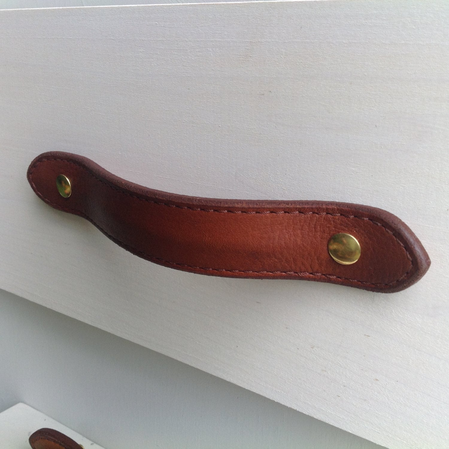Leather drawer pull for furniture, cases, boxes, etc. Hand