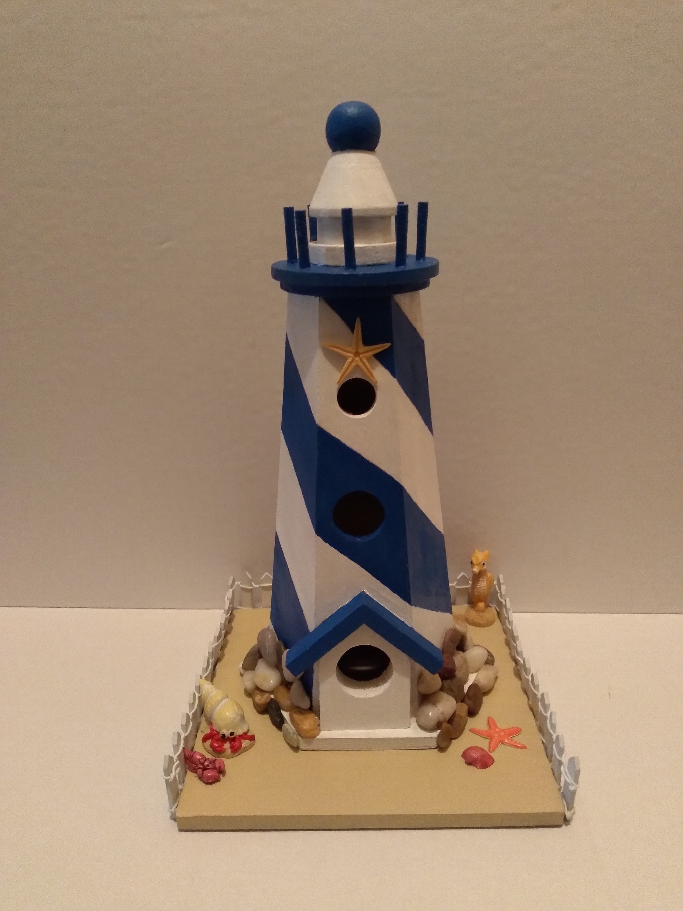 Lighthouse With White Fence
