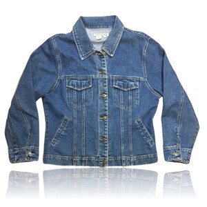 May include: A classic blue denim jacket with a button closure and multiple pockets.