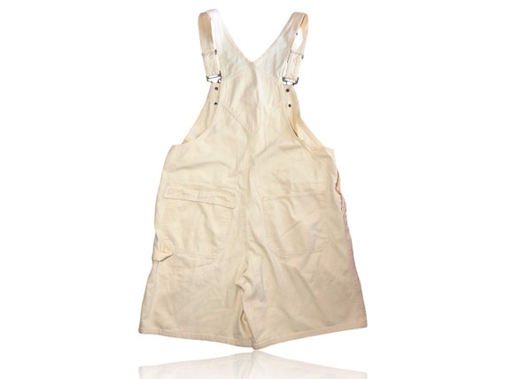 pastel yellow overalls