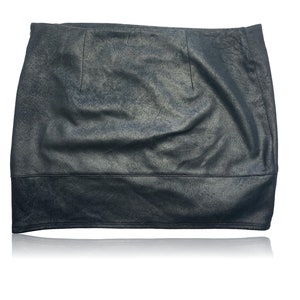 May include: A black faux leather mini skirt with a slight A-line shape.