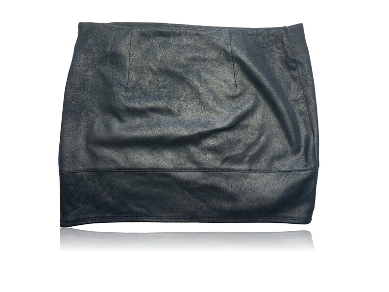 May include: A black faux leather mini skirt with a slight A-line shape.