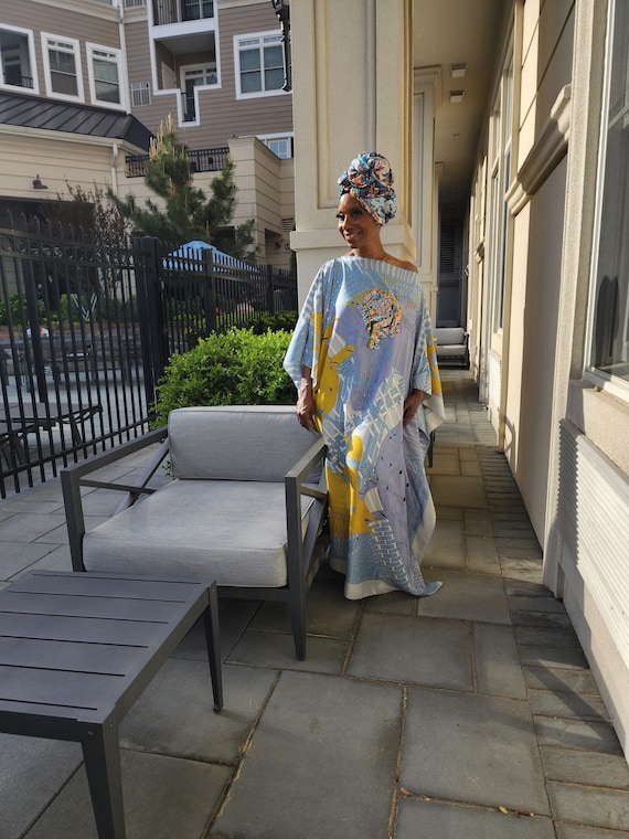 LiiLiiGiirl Kaftan Dress,  Soft blue and gold Kaftan dress with Sequin Afro-girl face