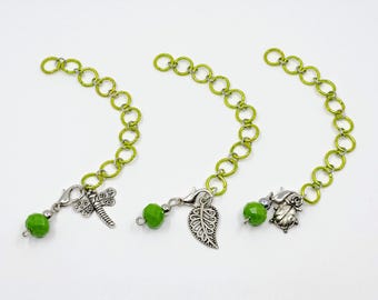 Small metallic green row counter/stitch marker with progress keeper - counts to 110.