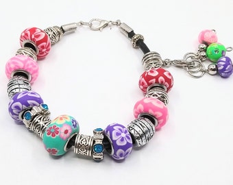 Multicoloured stitch marker keeper bracelet with Polymer clay Euro-style beads on a black leather cord