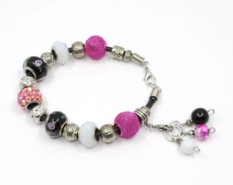 Pink/white/black stitch marker keeper bracelet with Euro-style beads on a black leather cord