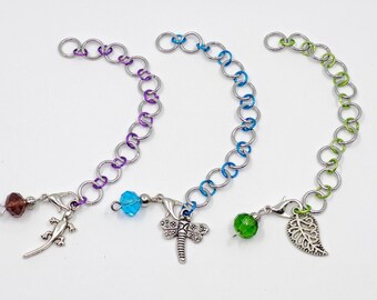 Small silver tone row counter/stitch marker with progress keeper - counts to 110.