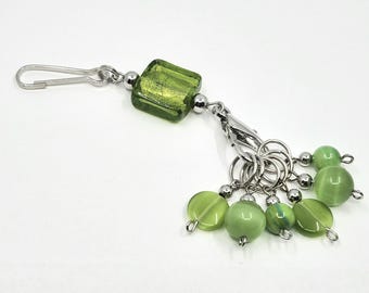 Green, foil, square, glass bead stitch marker holder featuring 6 green glass and shell bead stitch markers