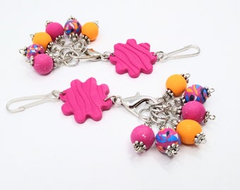 Pink flower-shaped polymer clay stitch marker holder with 6 removable knitting stitch markers