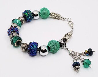 Iridescent purple/teal stitch marker keeper bracelet with Euro-style beads on a black leather cord