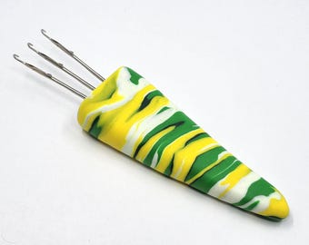 1 (S) swirl pattern Cord-i-Flix, i-cord making tool, in green, white & yellow polymer clay with 3 small hooks, for yarn weights sock to DK.