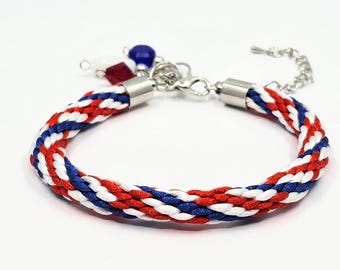 White, red and blue patterned Kumihimo woven stitch marker keeper bracelet and 3 stitch markers