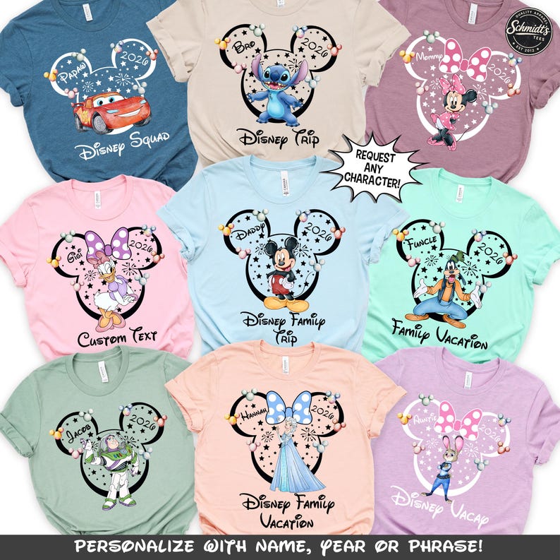 May include: A collection of colorful t-shirts featuring Disney characters and phrases. Each shirt has a Mickey Mouse head design with a character image, the year 2026, and text like "Disney Trip" or "Family Vacation". The shirts are available in various colors.