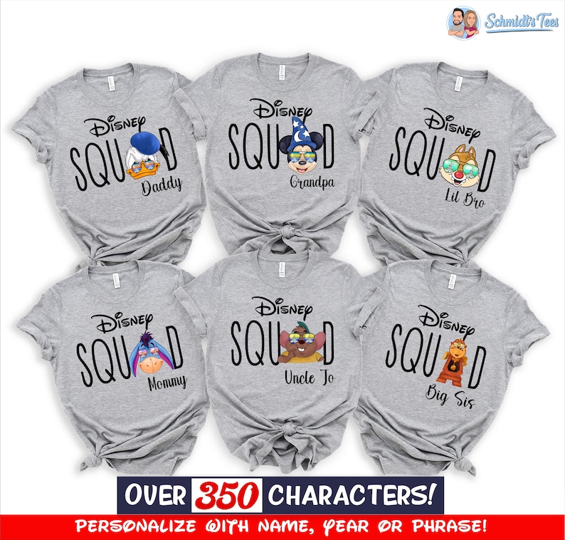May include: Six gray Disney Squad t-shirts with different Disney character graphics and family member titles. The shirts feature Donald Duck, Mickey Mouse, Chip, Eeyore, a Disney character, and Winnie the Pooh. Text on the shirts includes "Daddy", "Grandpa", "Lil Bro", "Mommy", "Uncle Jo", and "Big Sis".