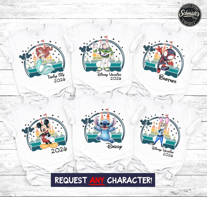 May include: White t-shirts featuring various cartoon characters like Ariel, Buzz Lightyear, and Mickey Mouse. Each shirt has a unique design with text such as "Family Trip 2026" and "Disney Vacation 2026". The shirts are part of a Disney-themed collection.
