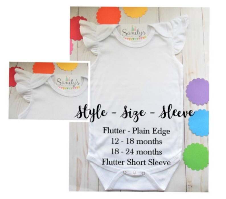 May include: White baby bodysuit with flutter sleeves. The bodysuit has the text "Sandy's" on the front. The text "Style - Size - Sleeve" is printed below the bodysuit. The text "Flutter - Plain Edge" is printed below the text "Style - Size - Sleeve". The text "12-18 months" is printed below the text "Flutter - Plain Edge". The text "18-24 months" is printed below the text "12-18 months". The text "Flutter Short Sleeve" is printed below the text "18-24 months".