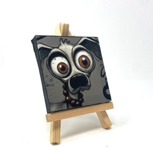 Mad J Gifts Enigmatic Paws mini canvas print. Gray background with big eyed dog.