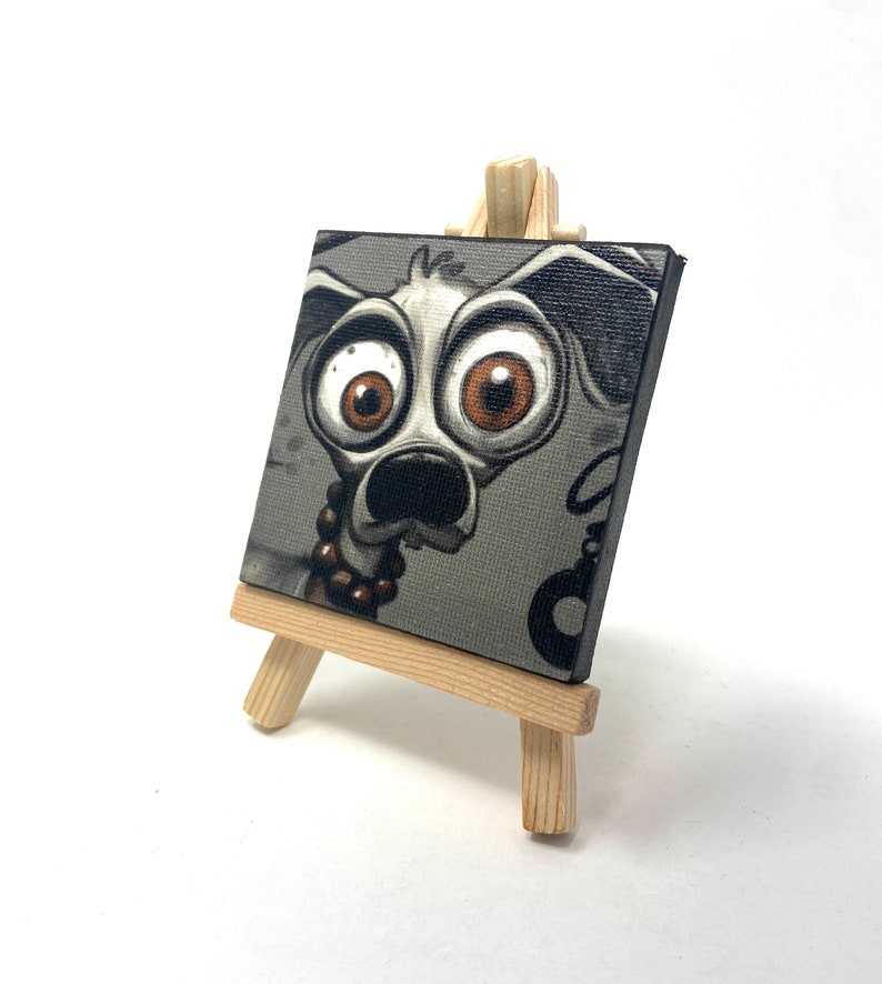 Mad J Gifts Enigmatic Paws mini canvas print. Gray background with big eyed dog.